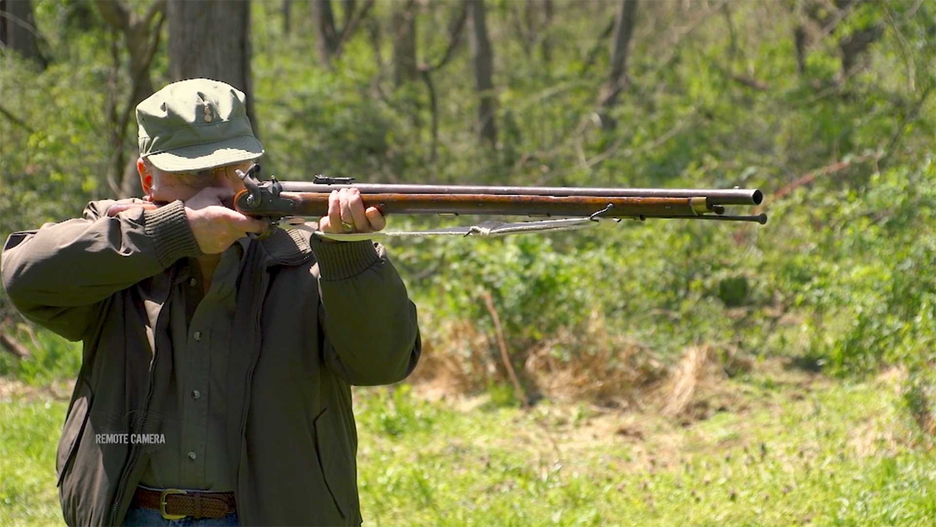 Man aiming Pattern 1851 Minie Rifle outdoors.