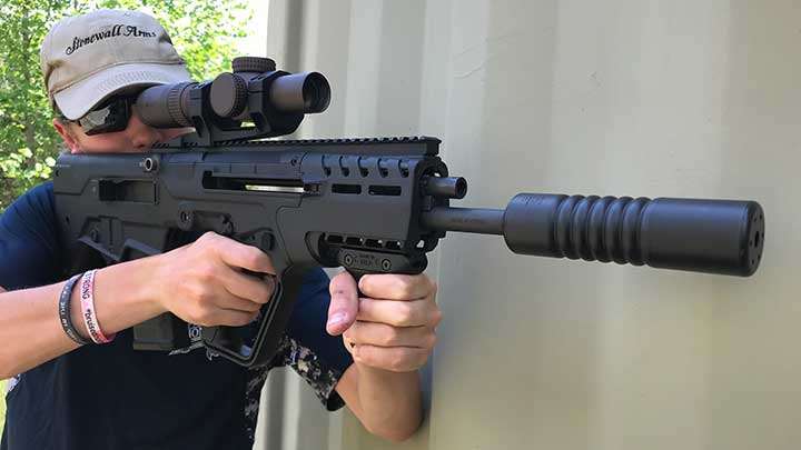 The 16.5&quot; barrel of the IWI Tavor 7 with CZ USA Ti Reflex suppressor attached.