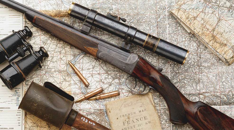 Holland and Holland rifle gun wood map ammunition binoculars