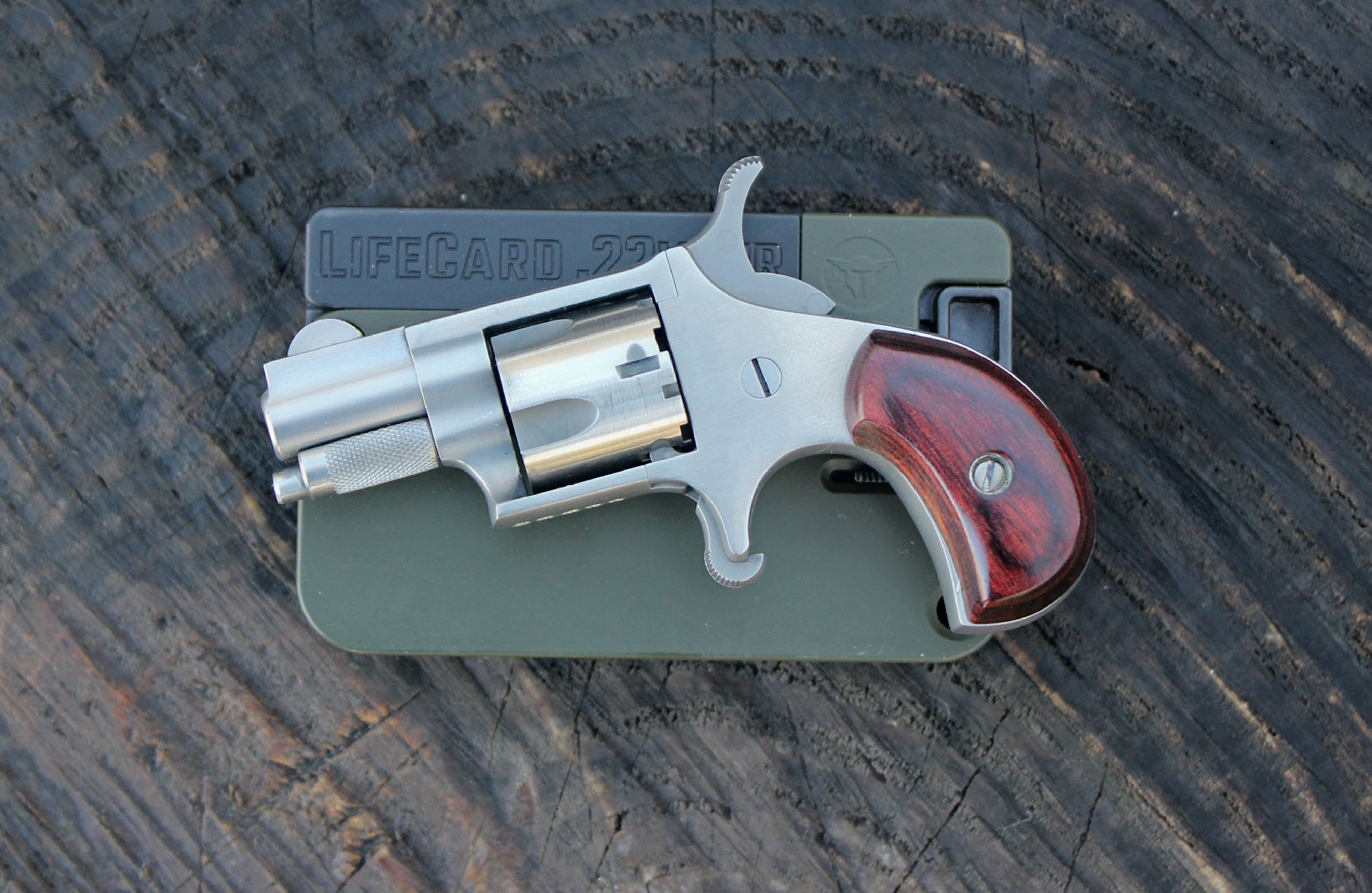 North American Arms revolver on lifecard folding handgun pistol guns wood table outdoors