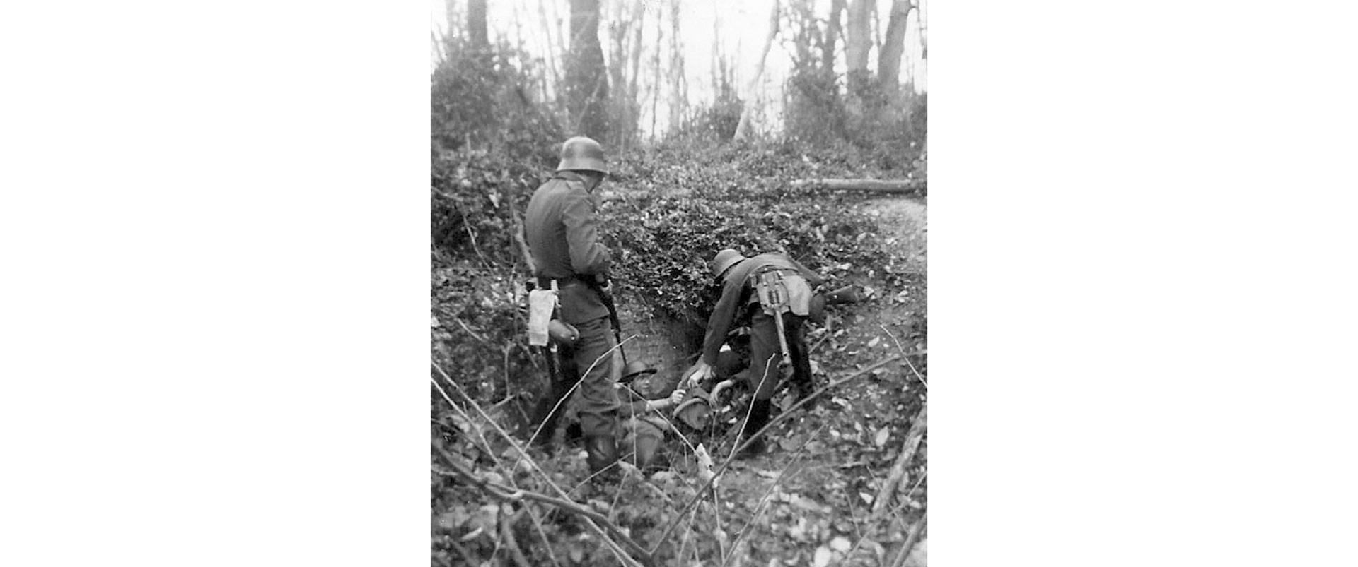 Vintage black and white photograph war prisoner of war pow trench outdoors guns military world war i