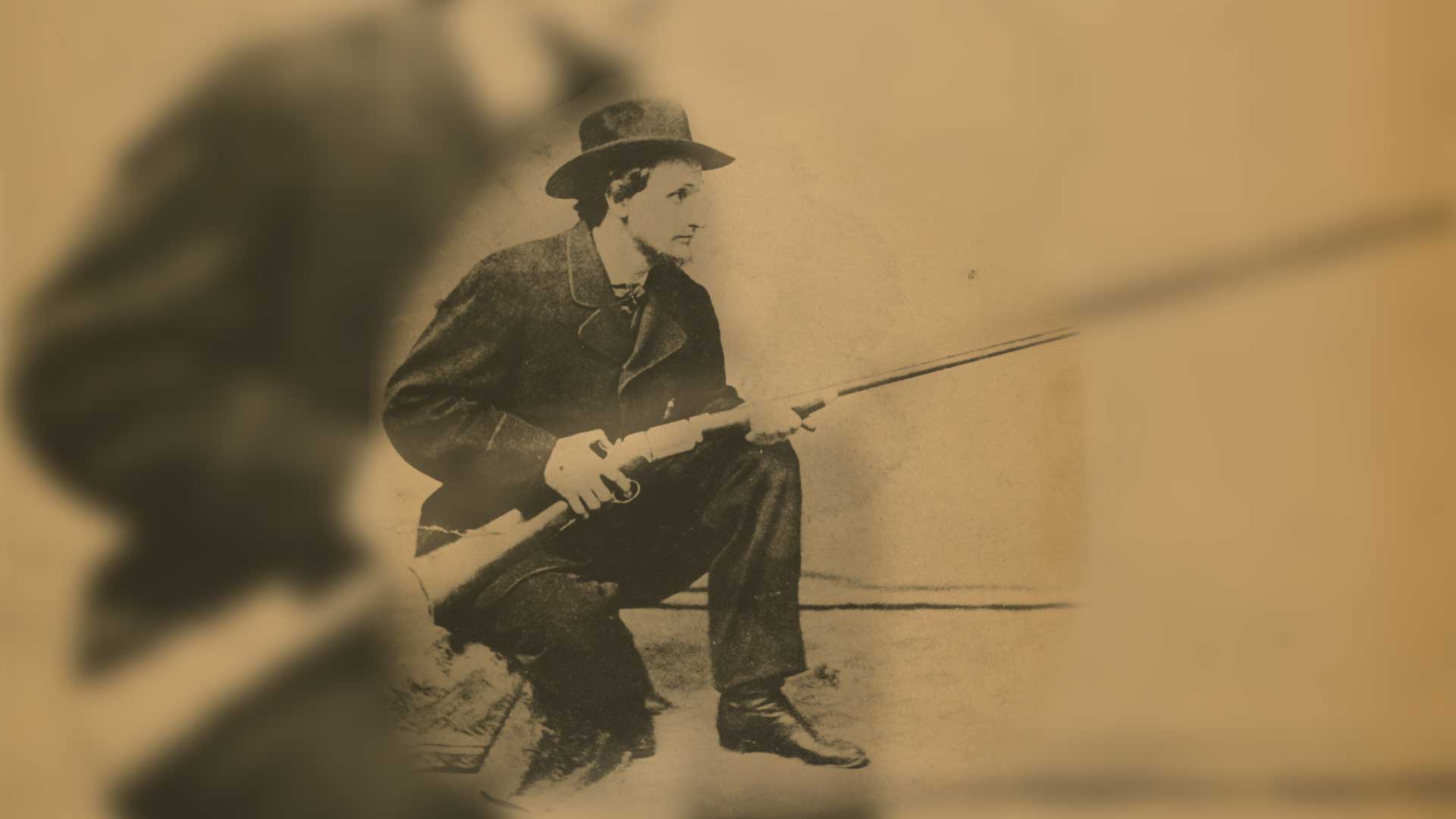 Christopher Miner Spencer man kneeling with rifle overlay