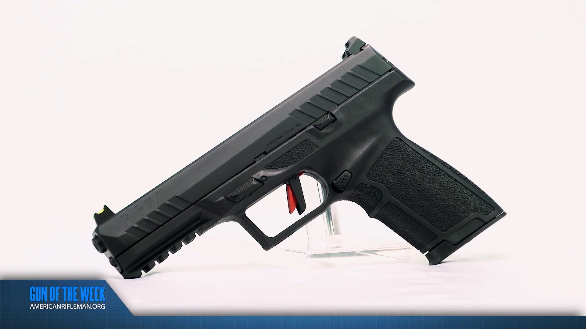 Tisas PX-57 pistol left-side view on white with GUN OF THE WEEK blue banner at bottom of image