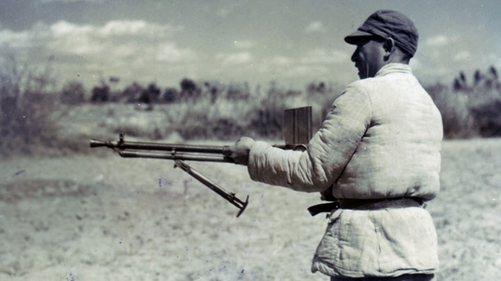 Chinese influence: A Chinese soldier with a Czech ZB vz. 26 light machine gun (7.92x57 mm).  The Chinese purchased more than 30,000 of these from the Czechs and made thousands more under license.