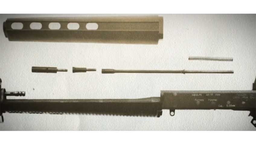 A dissasemled view of the AR-18&#x27;s piston cup, connecting rod, action rod and return spring that comprised its short-stroke-gas-piston system. This feature was later used on other modern rifle designs.