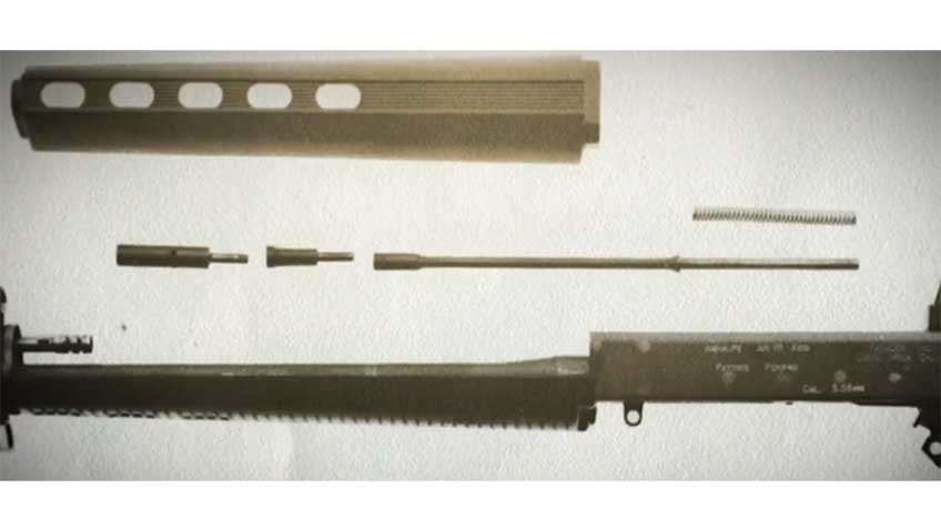 A dissasemled view of the AR-18&#x27;s piston cup, connecting rod, action rod and return spring that comprised its short-stroke-gas-piston system. This feature was later used on other modern rifle designs.