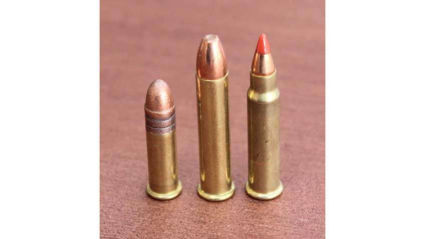 Three rimfire cartridges standing together: .22 Long Rifle (Left), .22 Mag. (Center), .17 HMR (Right).