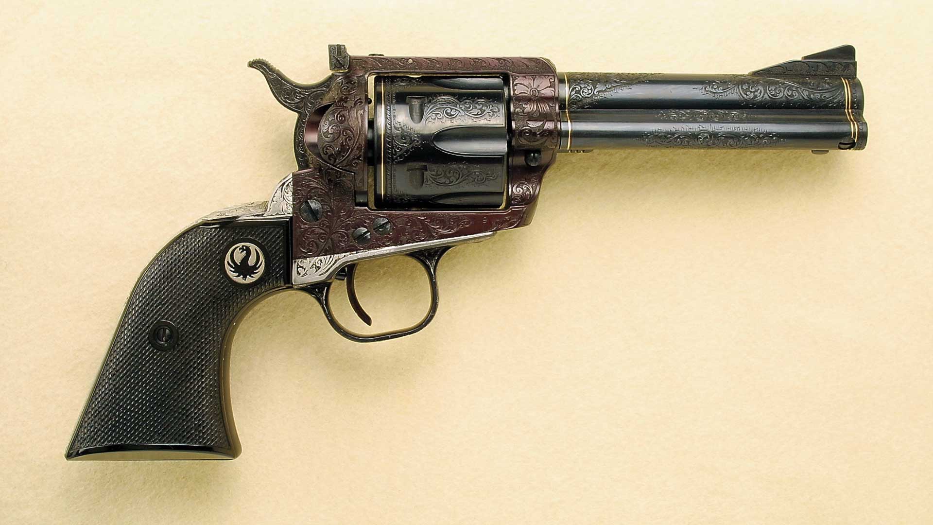 right-side view Ruger revolver six-gun engraved single-action pistol handgun yellow background