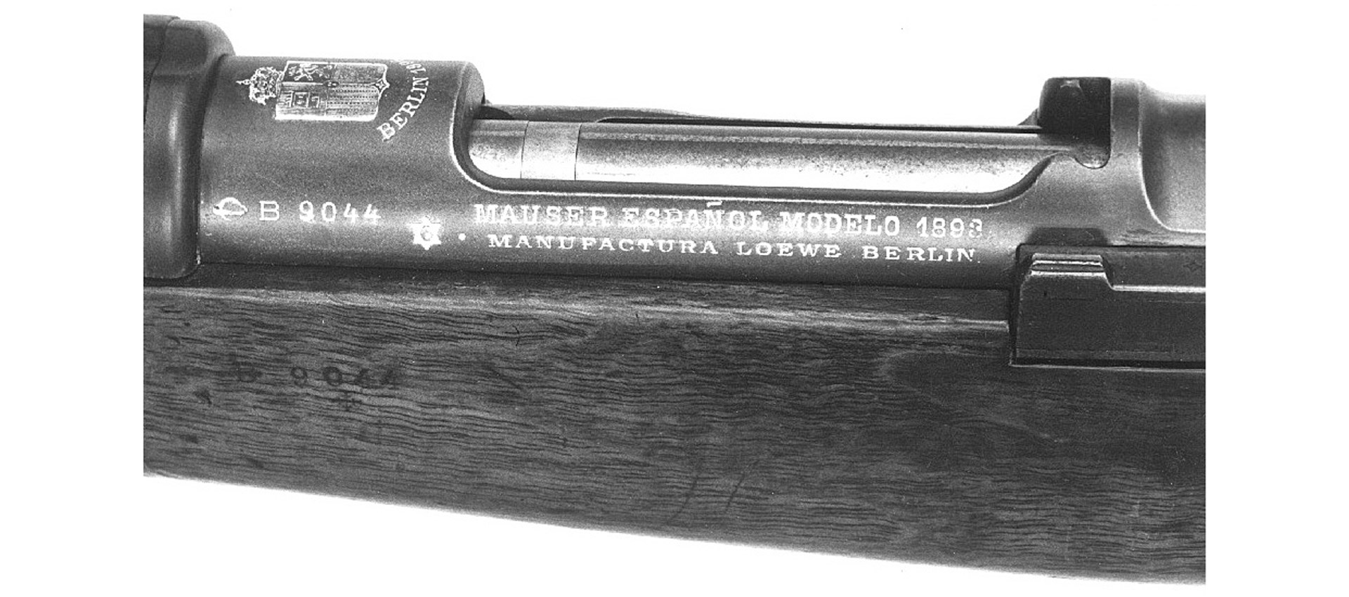 Closeup view bolt-action rifle spanish loewe mauser rifle action wood metal black white vintage