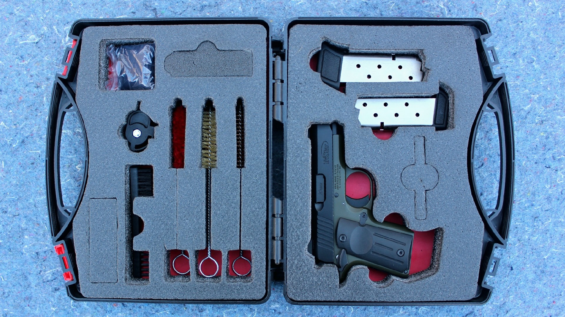 TriStar Arms Protege X pistol inside a carrying case with spare magazines and accessories.
