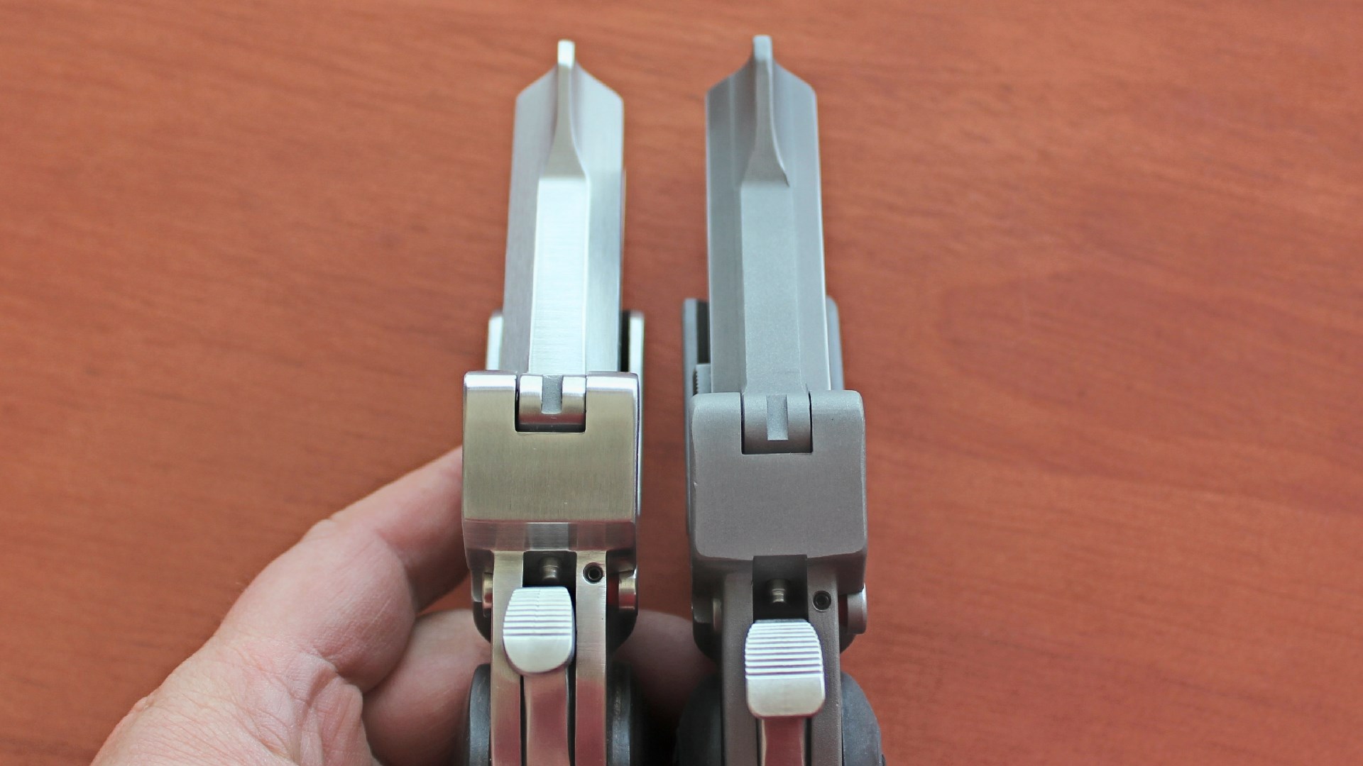 Top view of a Bond Arms Rough Series derringer next to a Defender Series derringer.