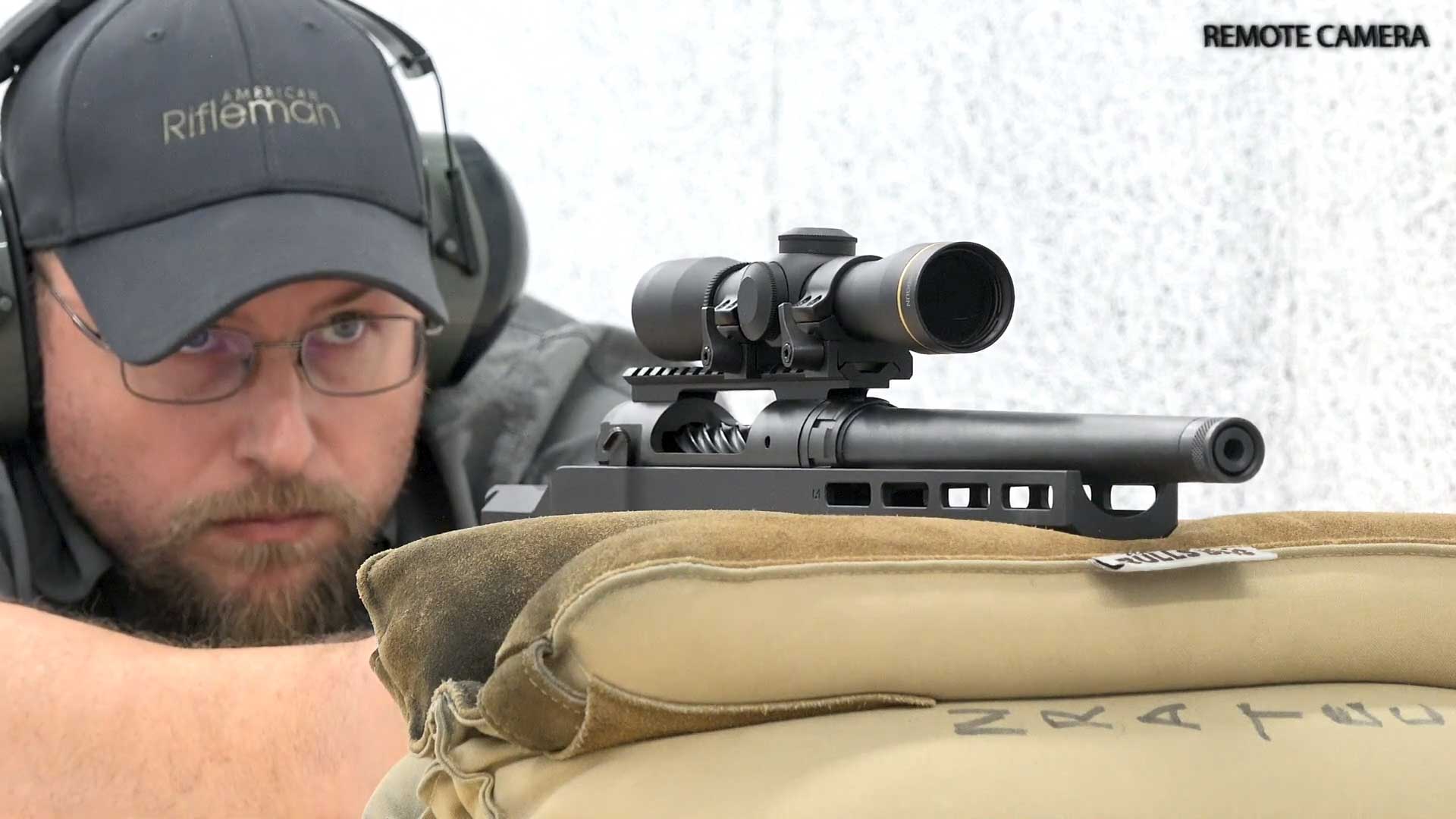 man ballcap shooting off bag rest black Savage Arms 110 PCS bolt-action handgun