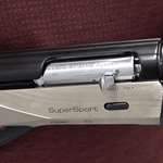 Benelli Ethos SuperSport Performance Shop shotgun 12 gauge action closeup in hands silver receiver blued barrel