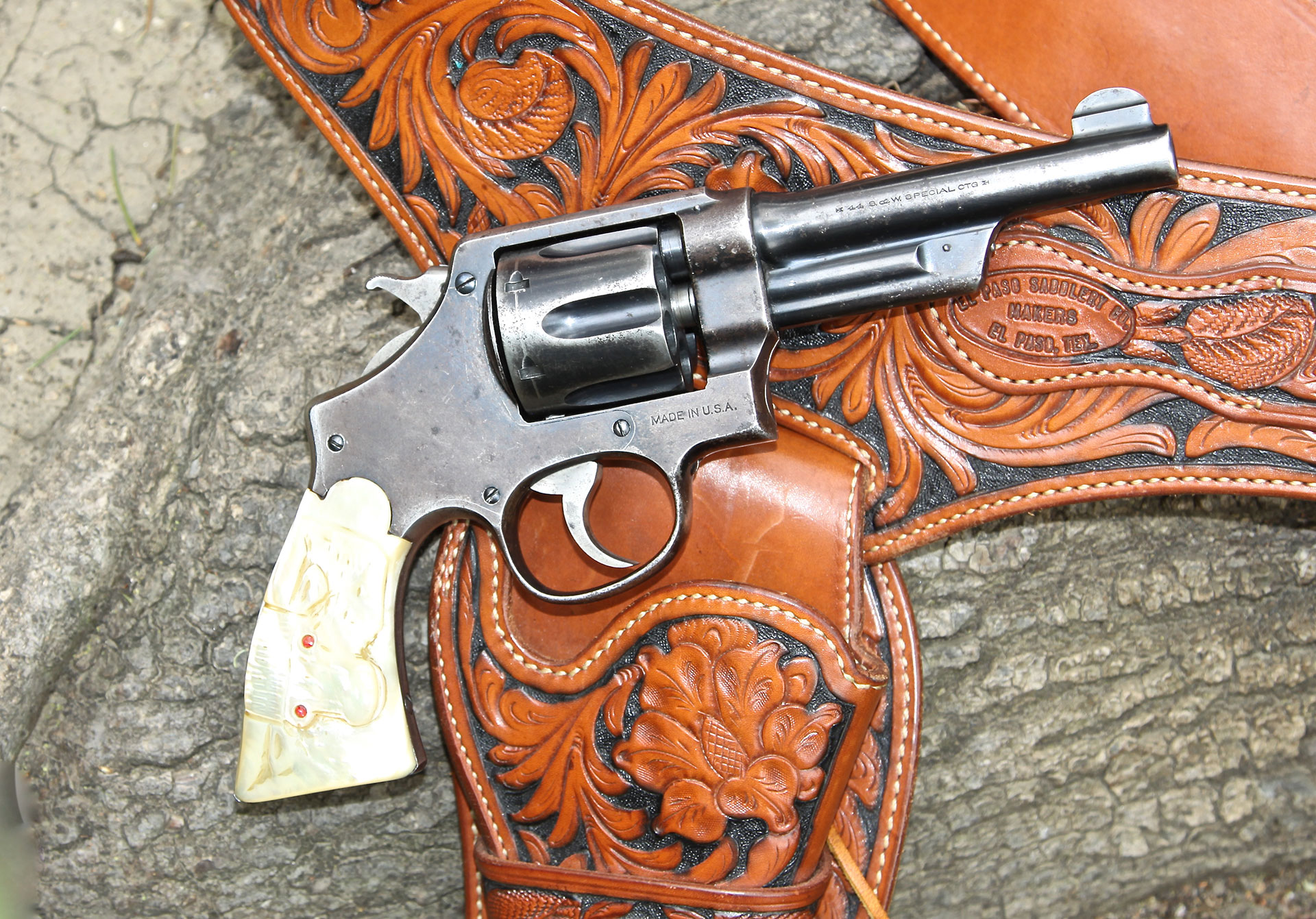 This S&W .44 Hand Ejector Third Model in .44 Special was shipped to Wolf & Klar on June 29, 1928 for a wholesale price of $21.90; it retailed for $36.50. The W&K carved steer head grips with ruby eyes (shown) set the buyer back another $12 (gold horns and nose rings cost slightly more). Appropriately, the ‘Smith is shown with a carved buscadero rig from El Paso Saddlery.