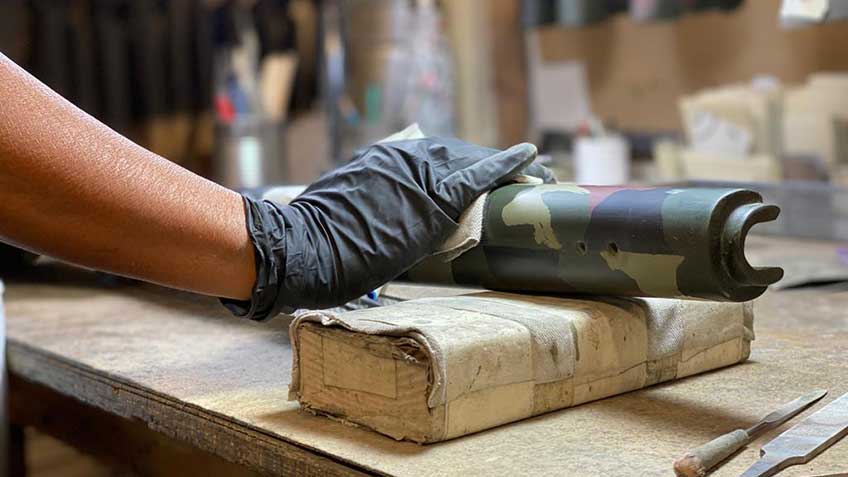 hand arm glove worker gunsmith manufacturing fiberglass gunstock McMillan