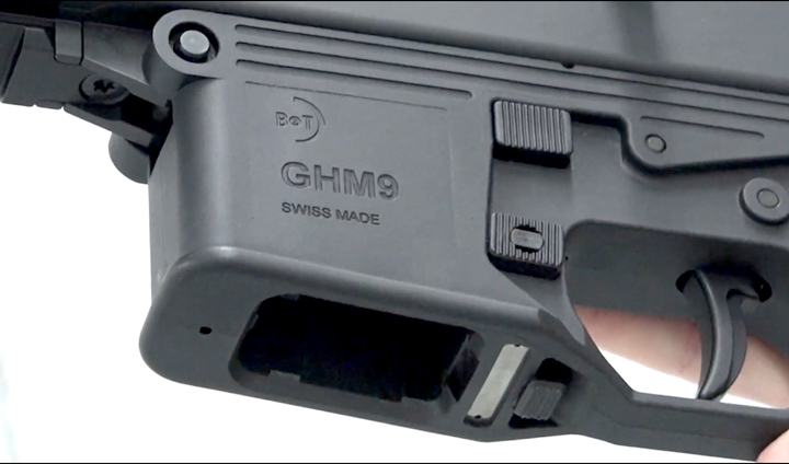 Left-side of GHM9 receiver showing the magazine well and controls.