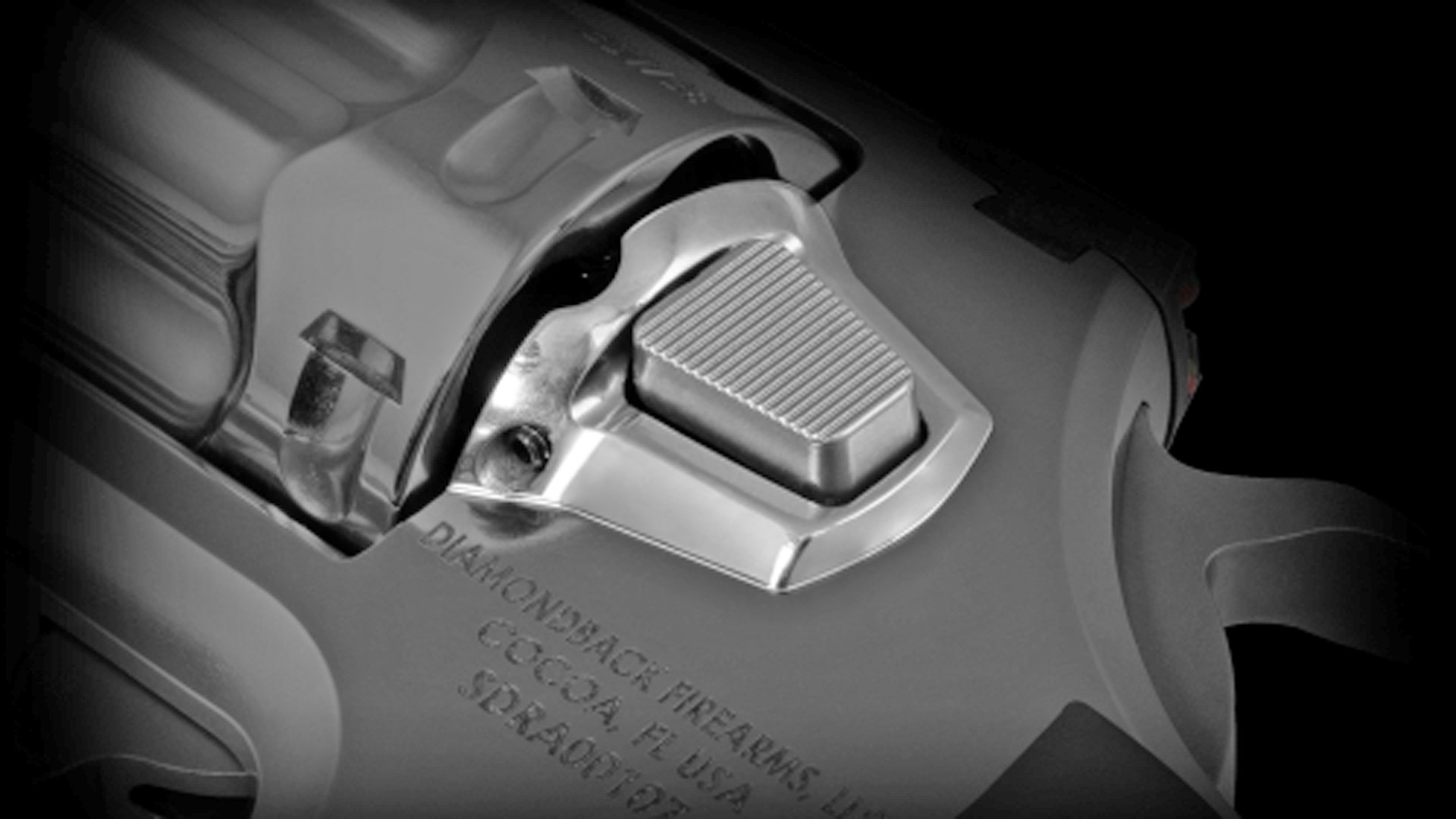 A push-button cylinder release shown on the left side of the Diamondback SDR revolver.