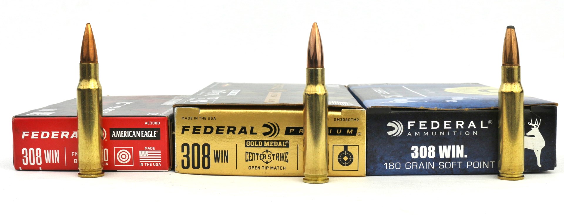 308 Winchester ammunition types side-by-side comparison three boxes three brass cartridges illustrating bullet types
