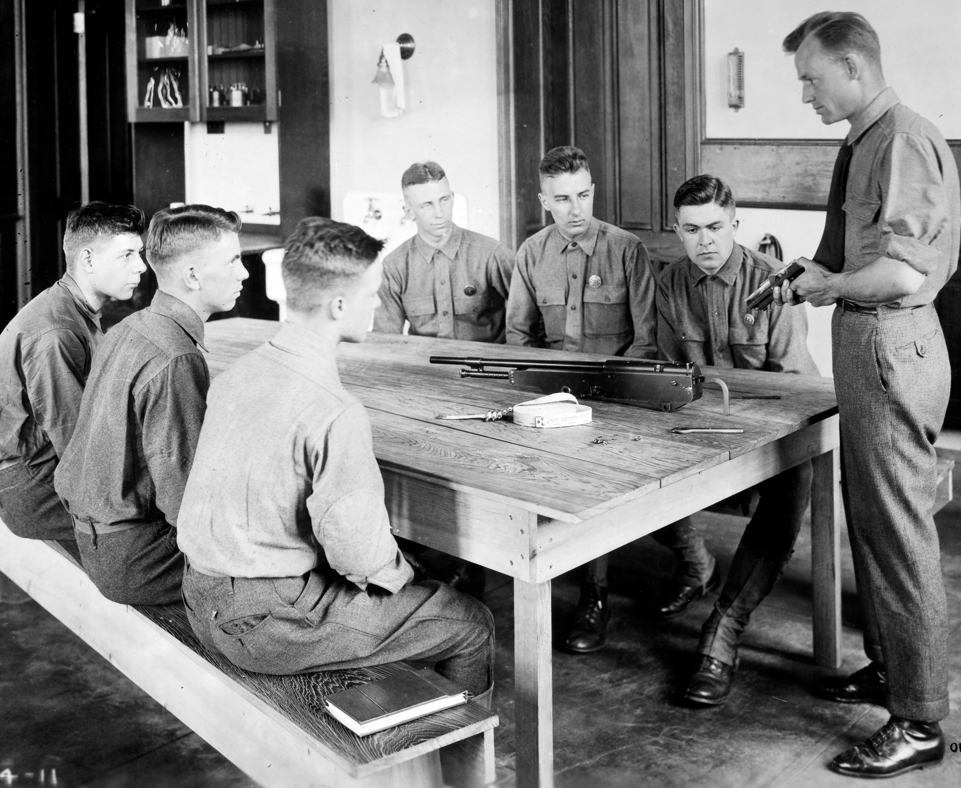 Learning the nuances of an aircraft machine gun: Aviation cadets at Princeton observe the workings of the Marlin aircraft machine gun. N.A.R.A. photograph.