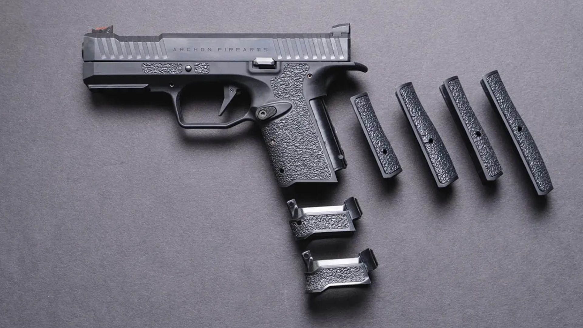 Archon Type B pistol shown with magazine well inserts and interchangeable backstraps.