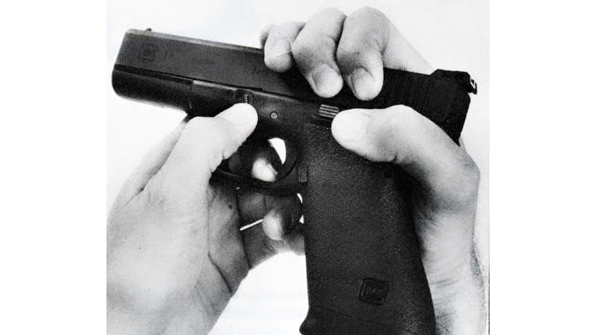 A pair of hands starting the disassembly process of a Glock 17 pistol.