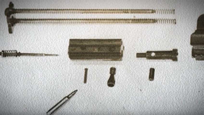 A look at the original AR-18 bolt carrier group disassembled. Note the two recoil springs on the guide rods just above the carrier.