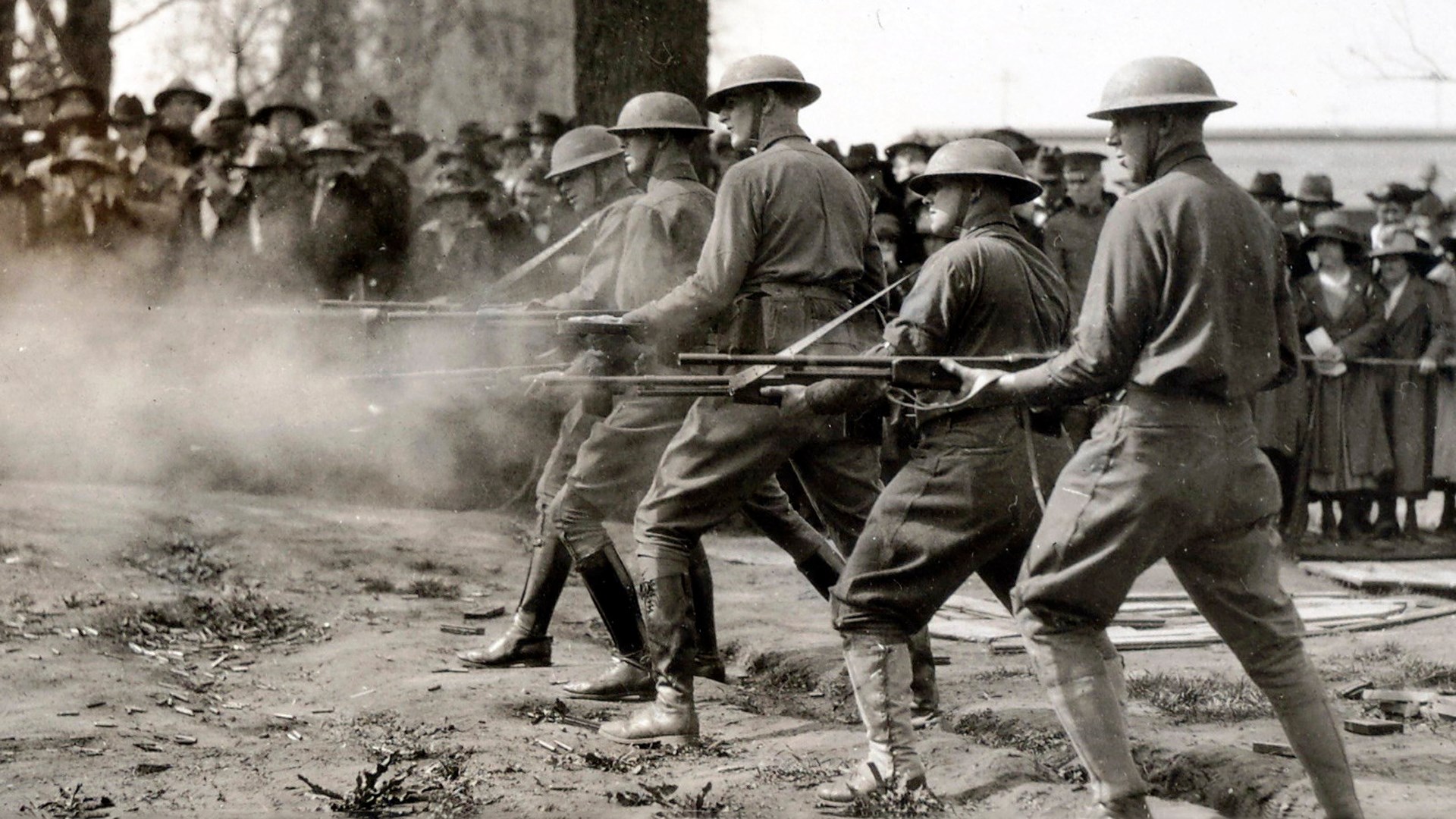 Soldiers from World War I training with BAR outdoors people watching spectators drills military doughboys