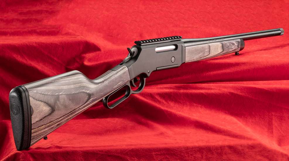 Henry Repeating Arms Long Ranger right-side view gun rifle lever-action hunting guns target shooting red background