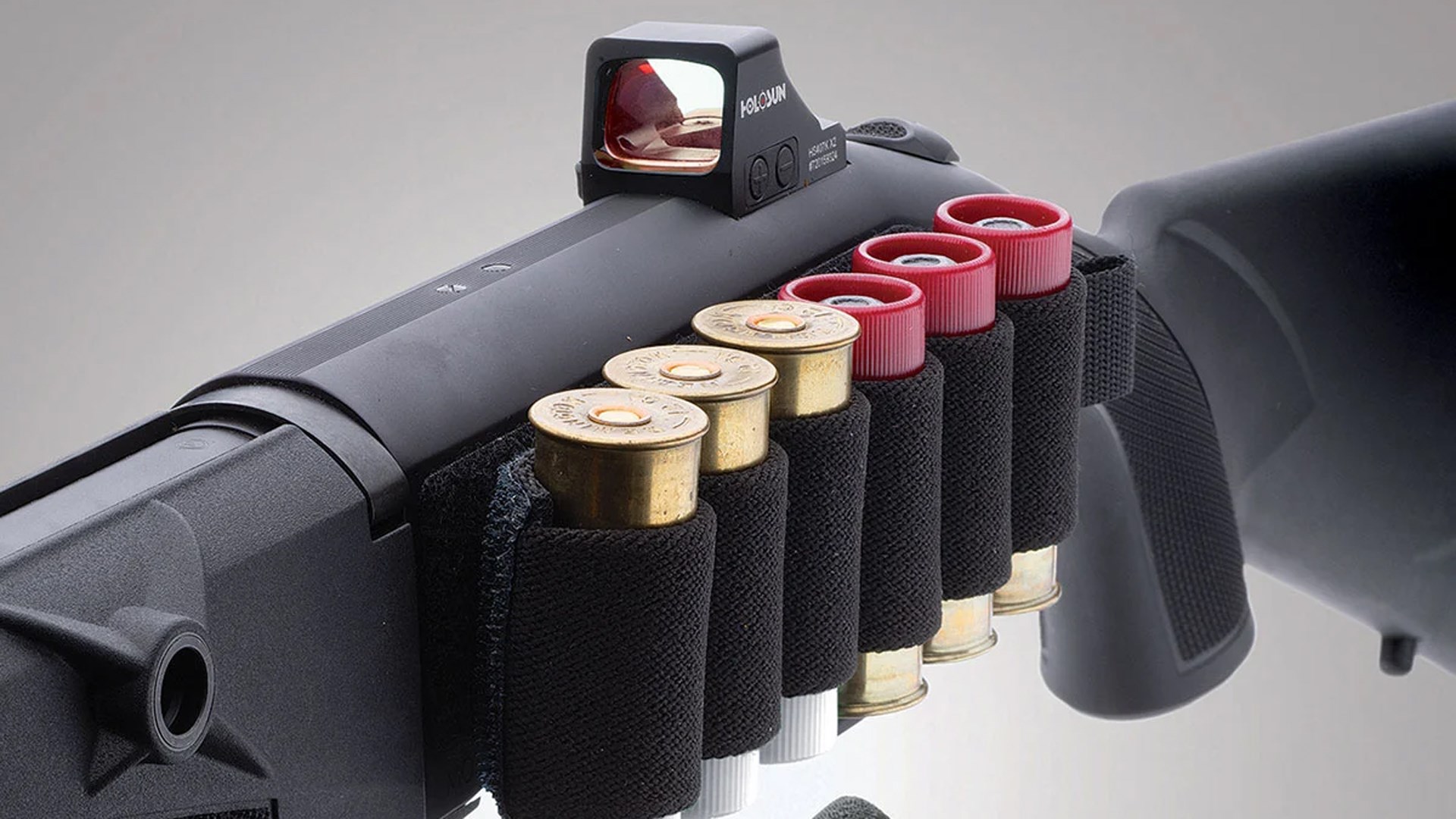 Vang Comp shotshell carrier located on the left side of the Mossberg 940 Pro Tactical shotgun's receiver.