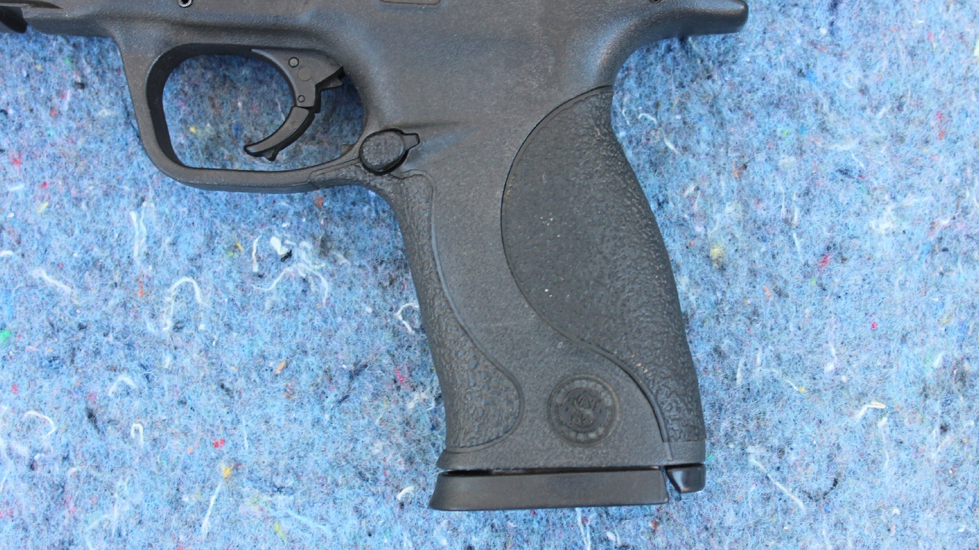 Smith & Wesson M&P 45 black plastic polymer frame illustrating removable grip inserts for custom fit