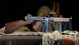 Thompson submachine gun on set with militaria gear 