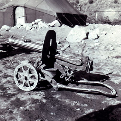 The Maxim Model 1910/30 (7.62x54 mm R) on a wheeled Vladimirov mount.  This later variant of the classic Russian Maxim machine gun (in service prior to WWI) features a radiator cap on the water jacket to allow snow to be easily packed in to help keep the barrel cool.