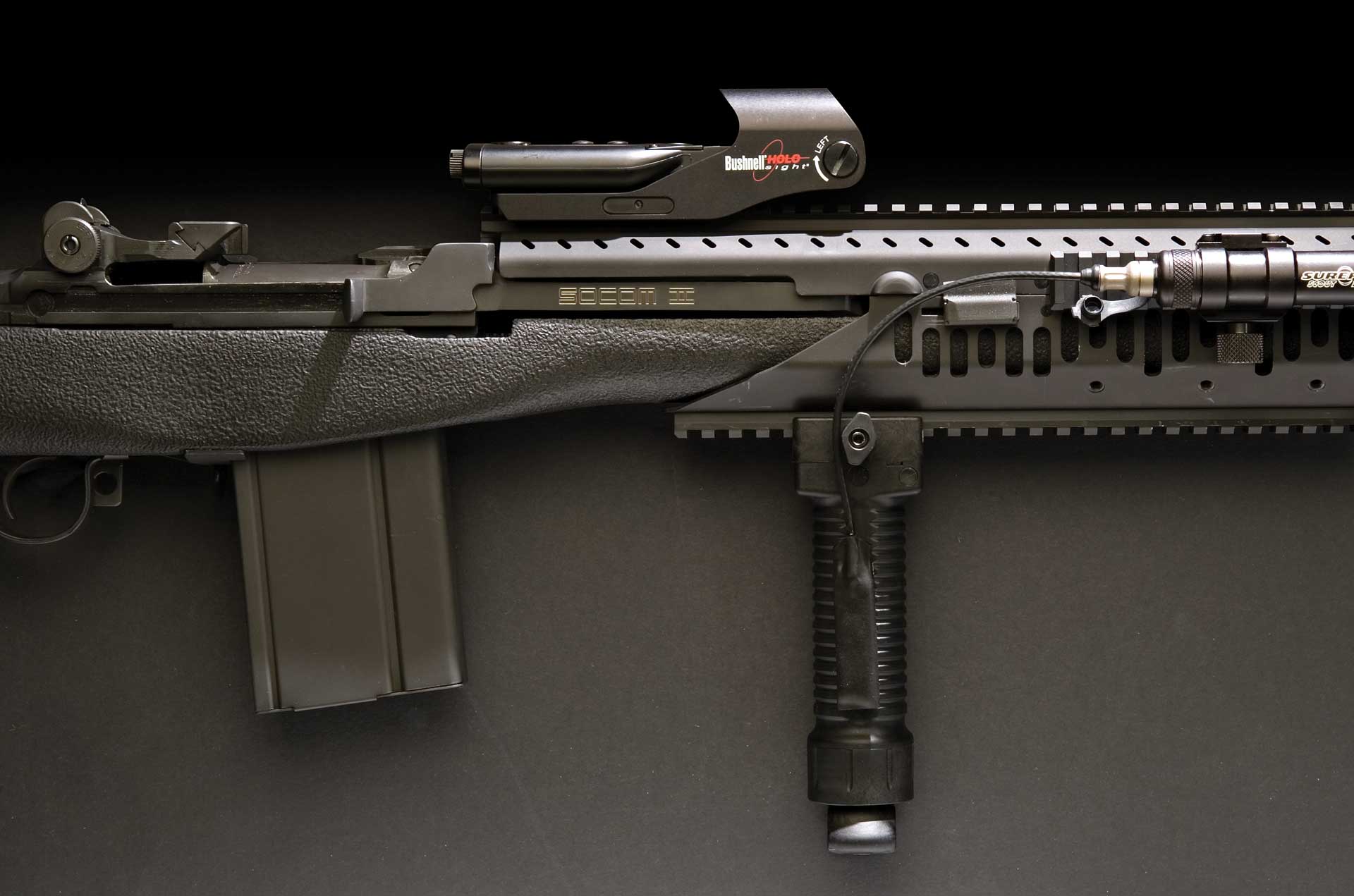 Right-side springfield armory socom ii action picatinny rail foregrip optic detachable box magazine black semi-automatic rifle dark background