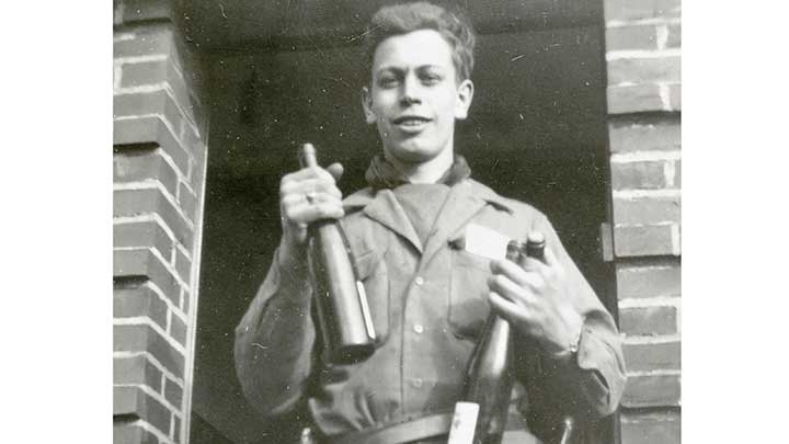 Sgt. Laemlein after the battle of Cologne was won, with liberated German wine.