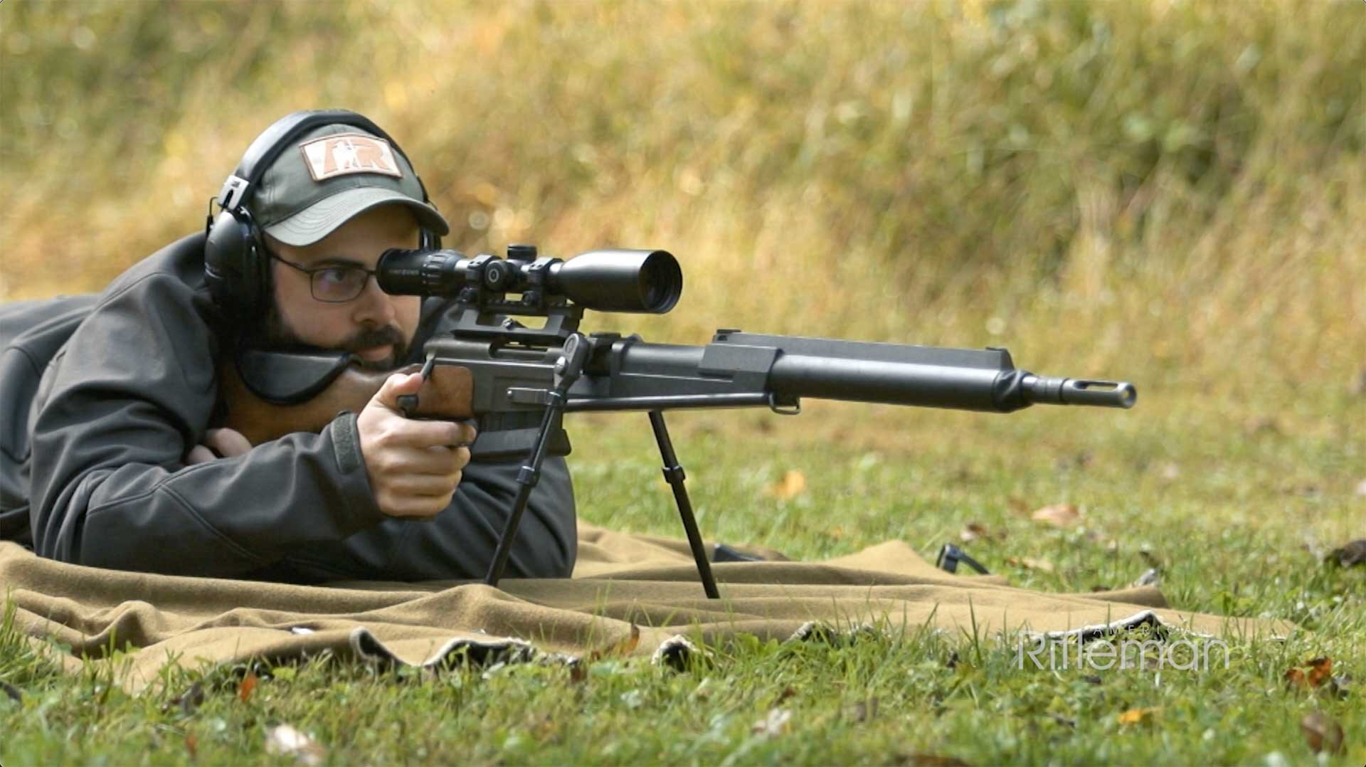 Man aiming downrange with a French FRF2 sniper rifle.