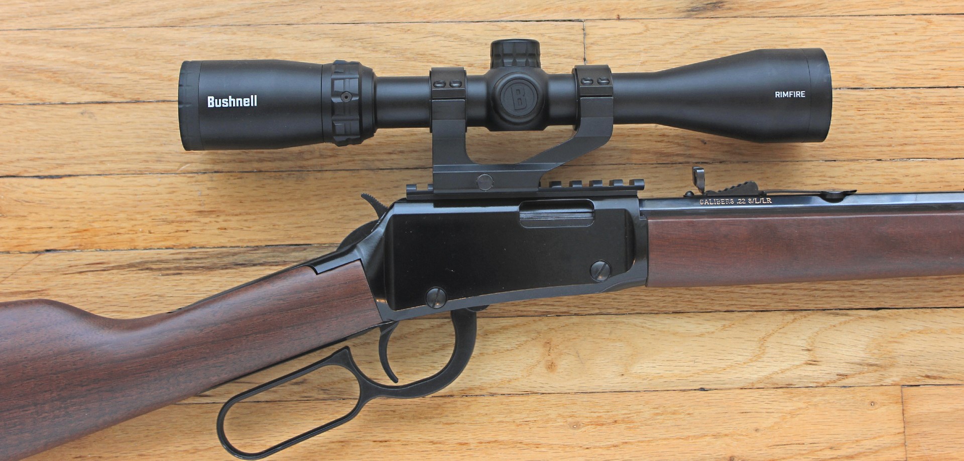 Henry H001 lever-action .22lr rifle shown with Bushnell 3-9X 40 mm DZ22 riflescope