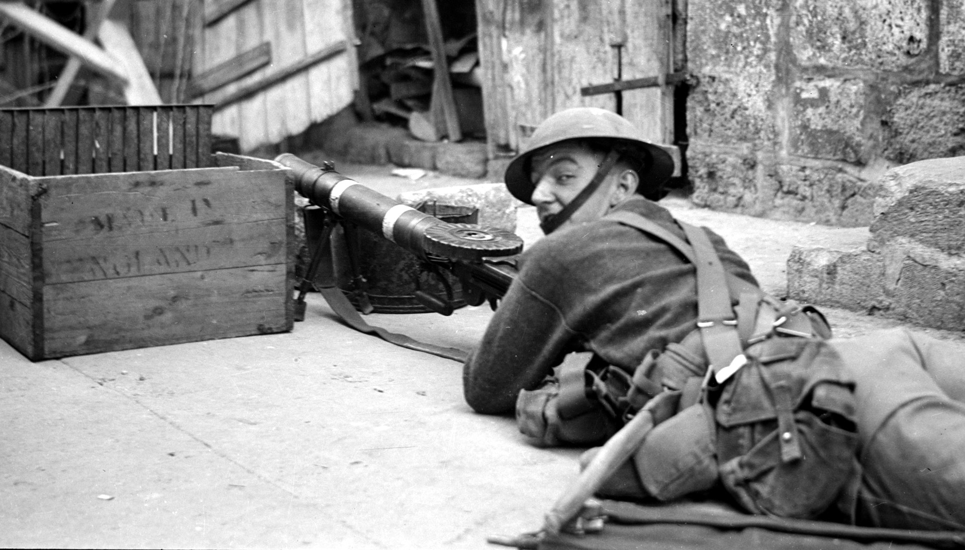 A Lewis gunner on the streets of Jerusalem during 1938.  The Lewis had proven itself during World War One and remained as the British light machine gun until the Bren was fully issued by 1939.  Note the standard 47-round pan magazine (with an additional magazine carried in the canvass holder on the gunner’s hip).  Library of Congress