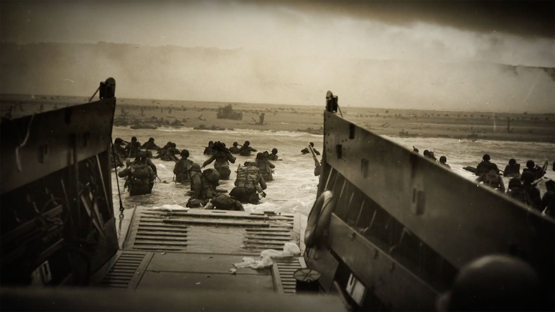U.S. troops seen wading ashore at Omaha after leaving their landing craft on June 6, 1944.