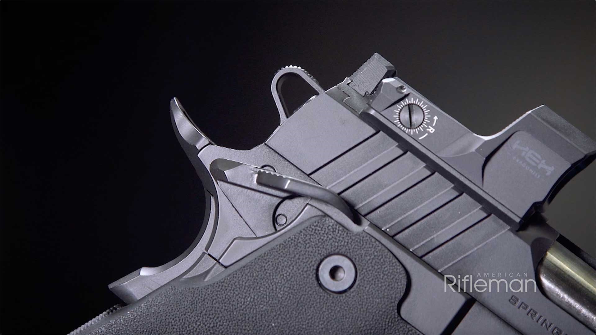 Skeletonized hammer, beavertail grip safety and right-side thumb safety located at the top-rear of the Springfield Armory Prodigy pistol.