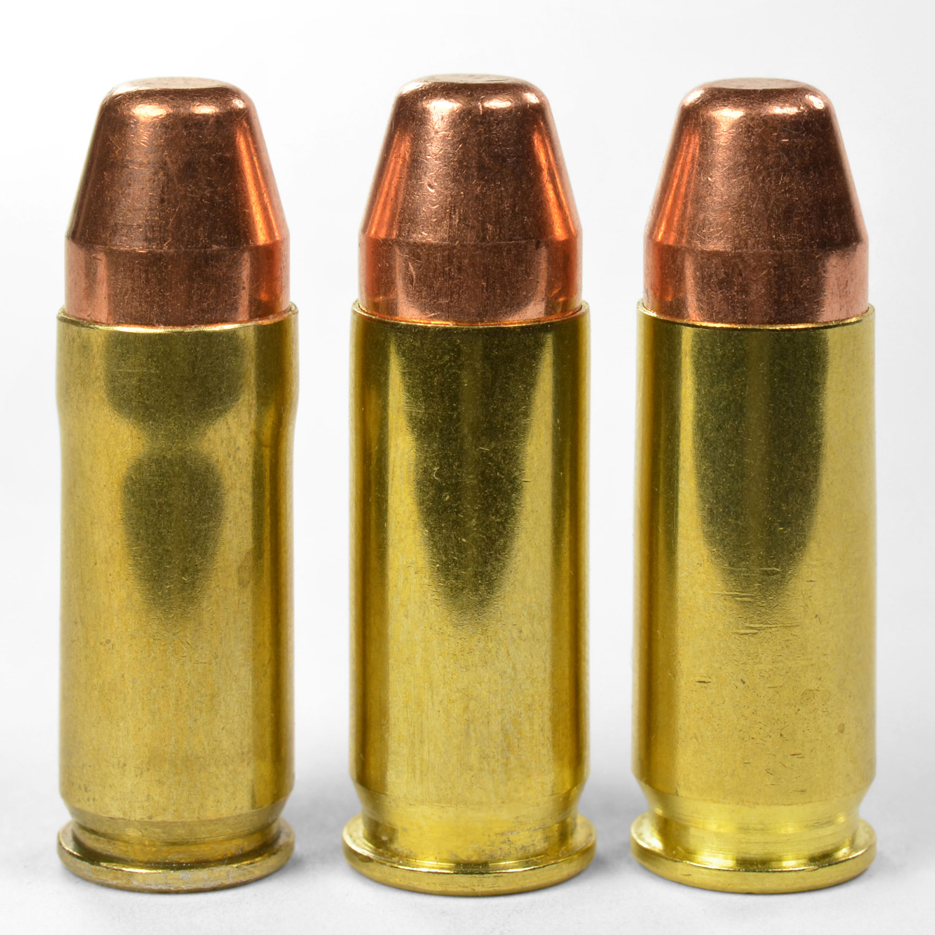 Ammunition comparison (from the left) of a Super Cooper, .38 Super and 9X23 mm Winchester. it’s hard to tell them apart except for the unusual shape of the Super Cooper.