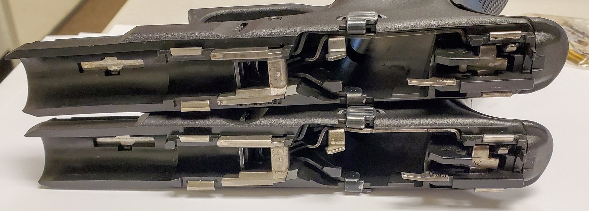 The G19 and G47 frames are the two frames with slides off to show that there is no difference in the two with regard to length, location, shape of the rails, locking block, etc.