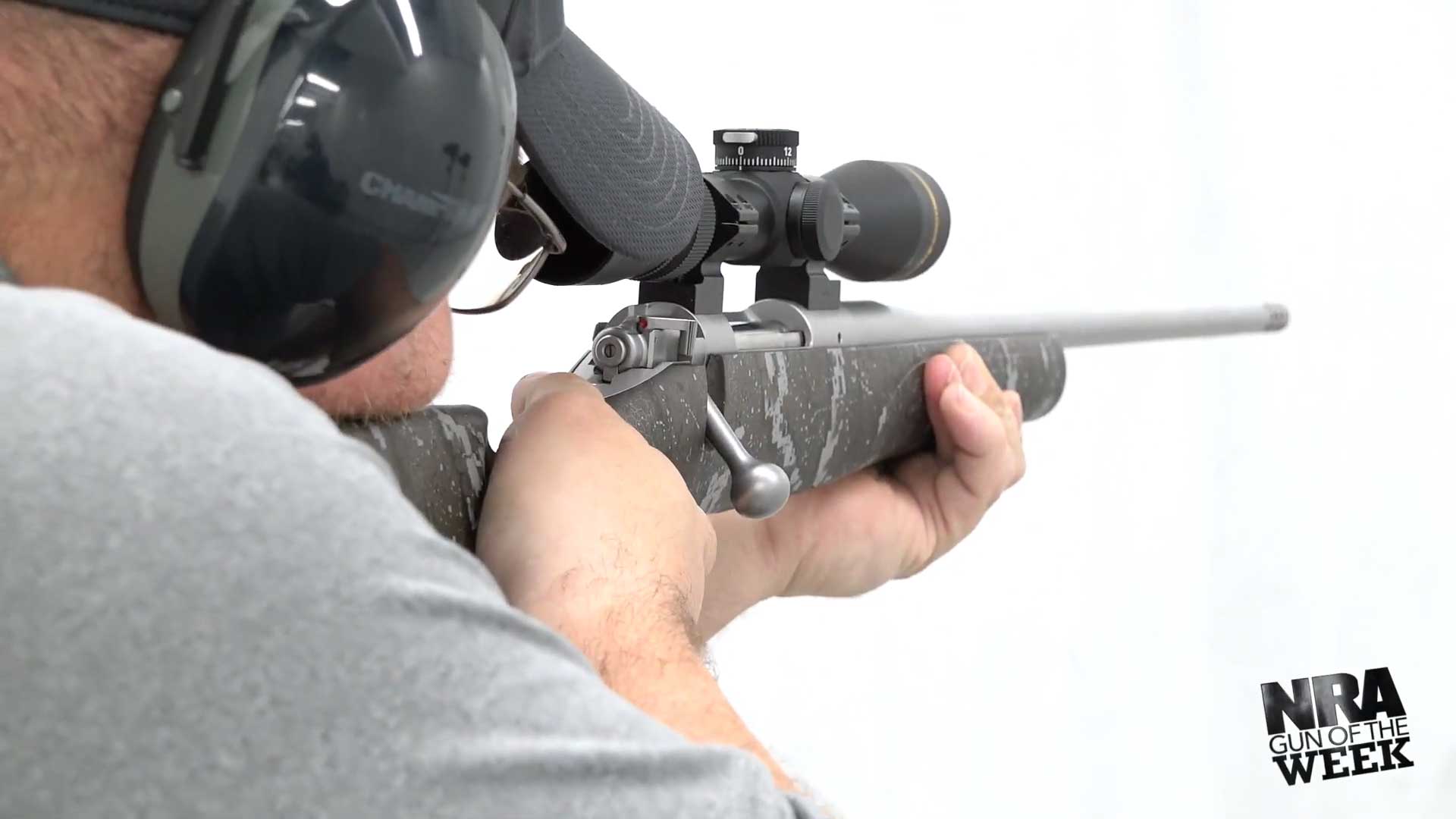 Kimber America 84M Pro Desolve Blak rear action view shooting range man ear protection hat riflescope