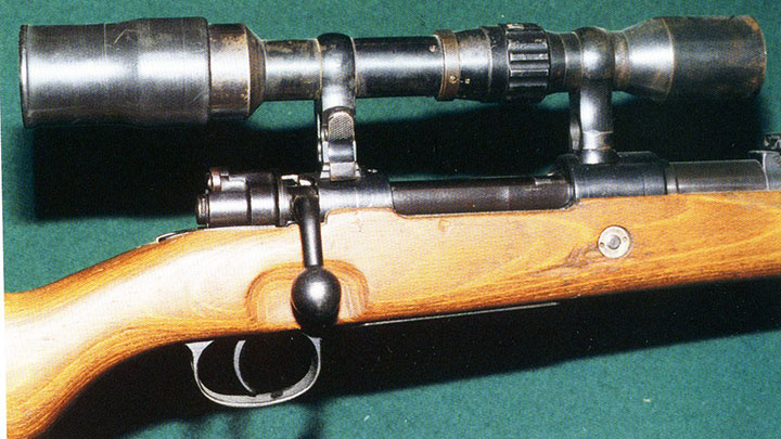 A SS issue double-claw mount with Opticotechna scope. The knurled focussing rind is just behind the front mount.