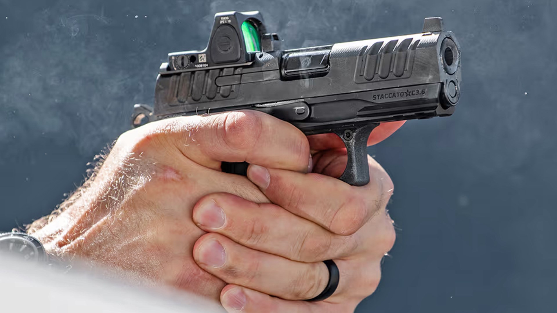 Man shooting an optic-equipped Staccato 2011 HD C3.6 pistol.