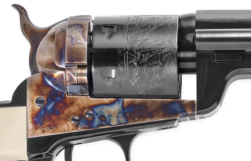 Close-up of revolver multi-colored frame and engraved blued cylinder.
