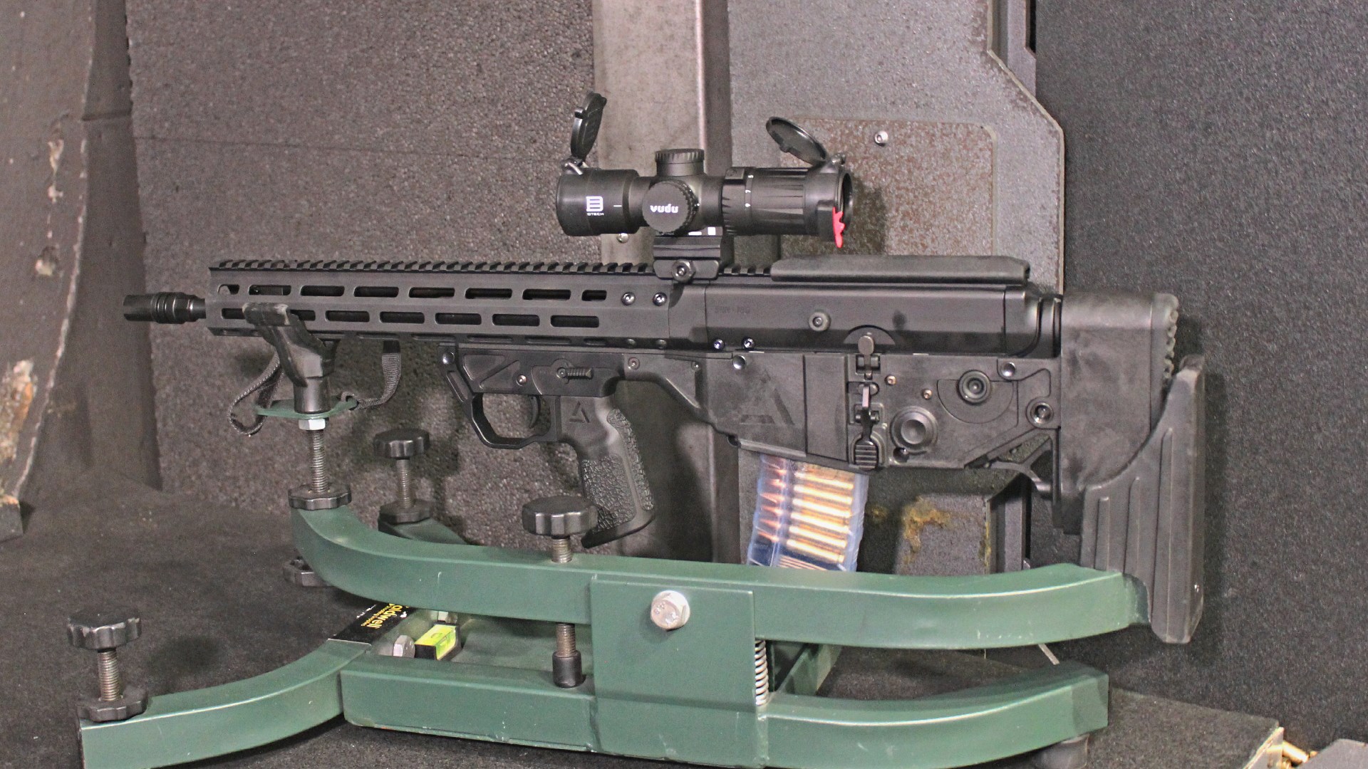 A3 Triad Bullpup carbine chassis shown on shooting range with Eotech Vudu riflescope in cradle