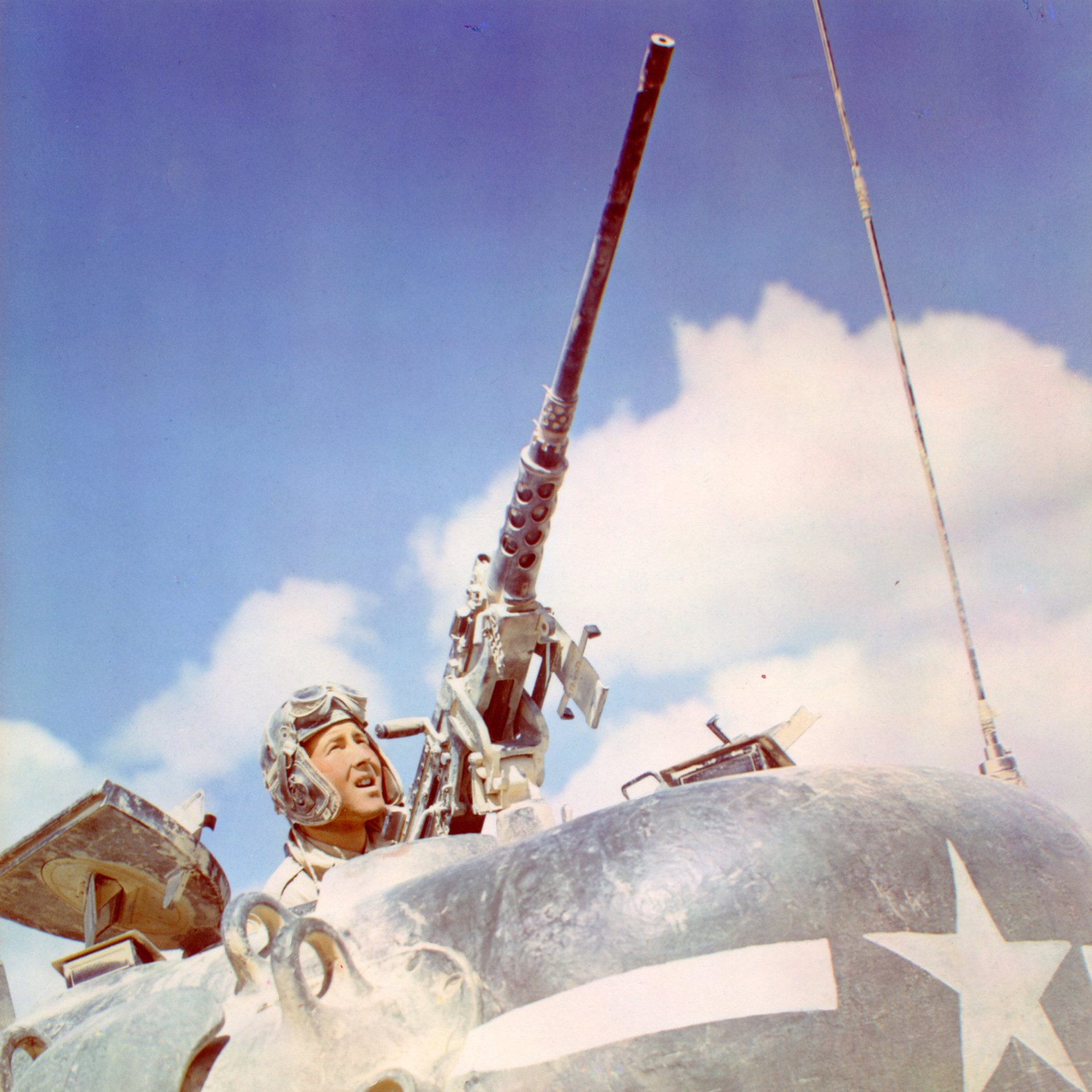 The Browning M2 .50 caliber MG mounted for M4 Sherman tank commander to use. Note the Browning M1919 .30 Cal MG in the coaxial position. Originally intended for AA use, the big .50 Cal gained more importance as an anti-personnel weapon as the war progressed.