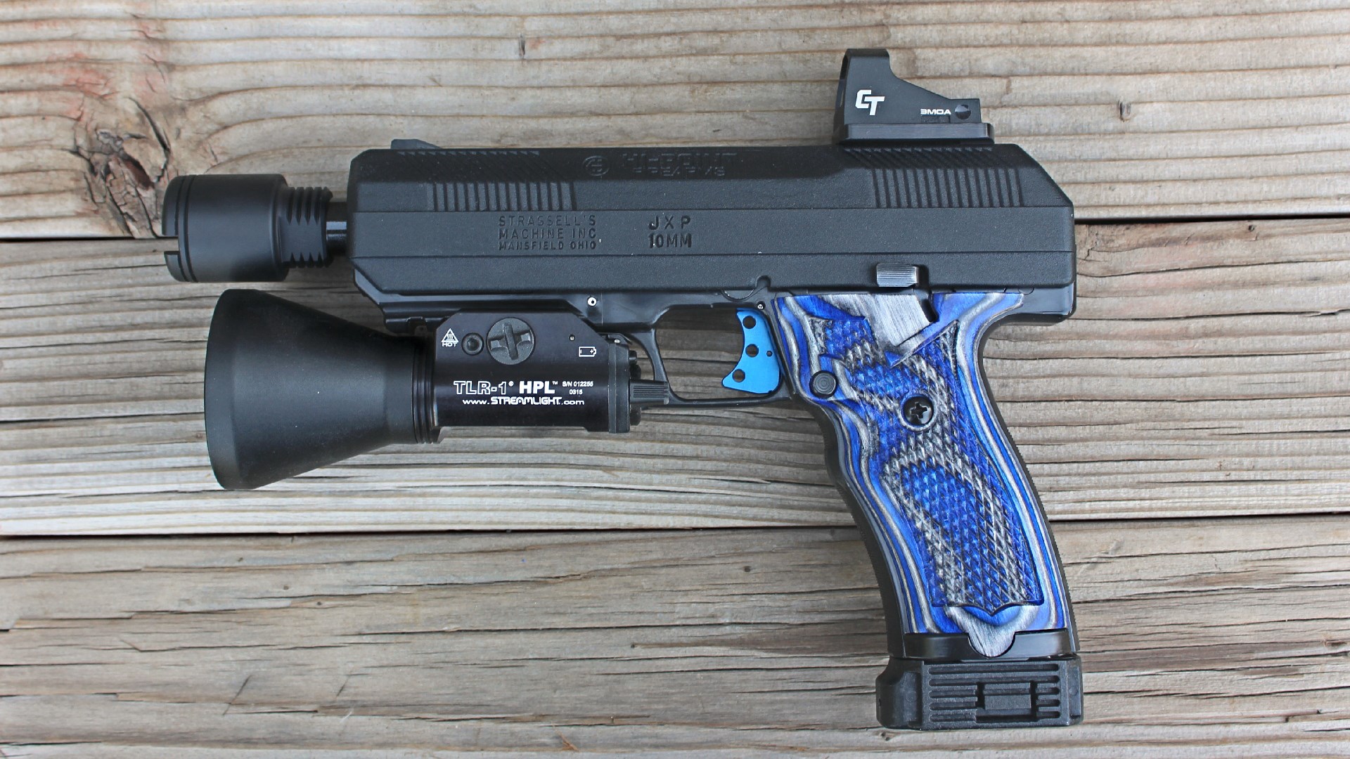 Left-side view of Hi-Point JXP 10 semi-automatic pistol shown with upgrades blue stocks blue trigger red-dot optic muzzle device and flashlight