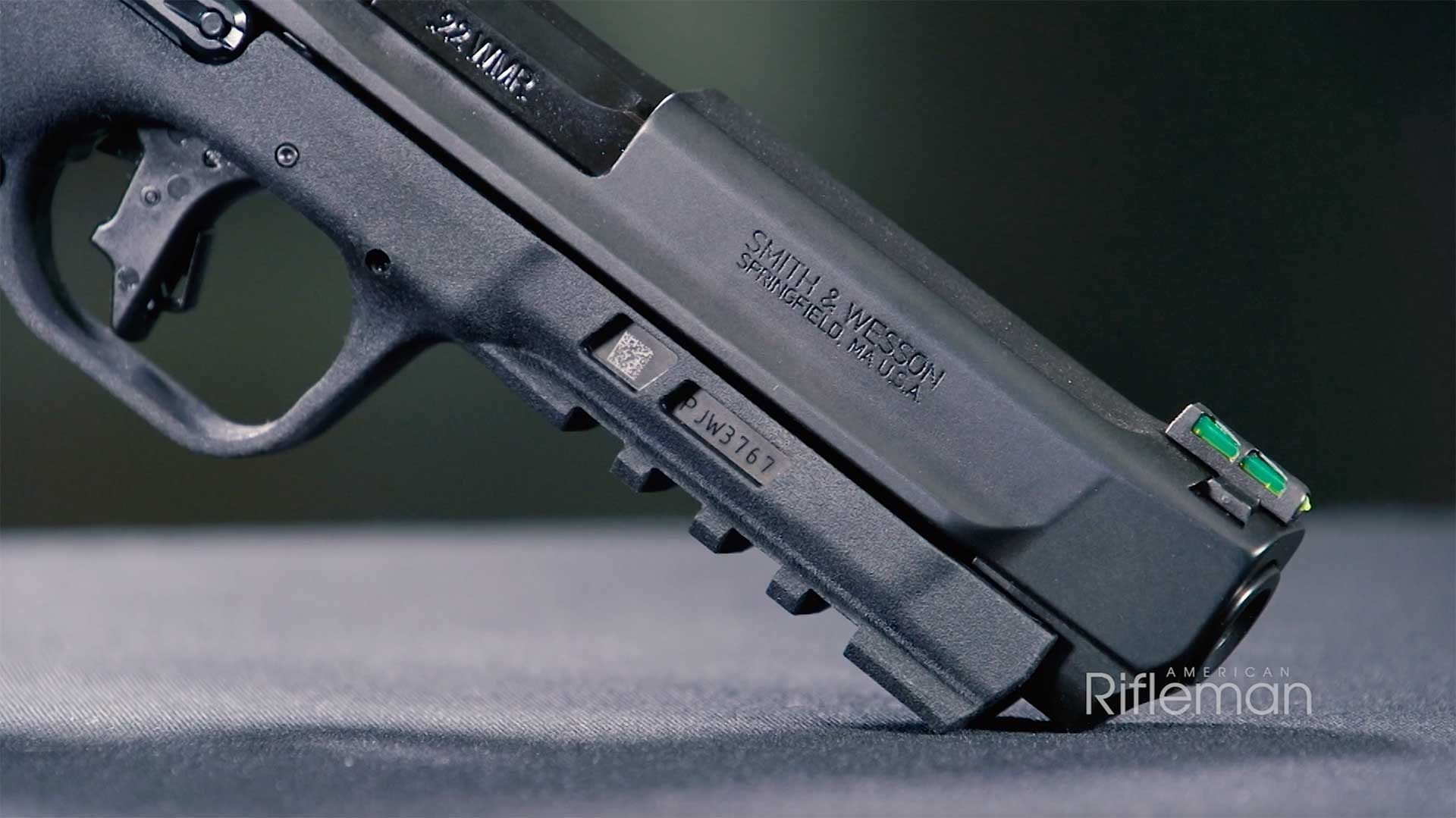 Muzzle, Picatinny accessory rail and front sight on the Smith & Wesson M&P 22 Magnum pistol.