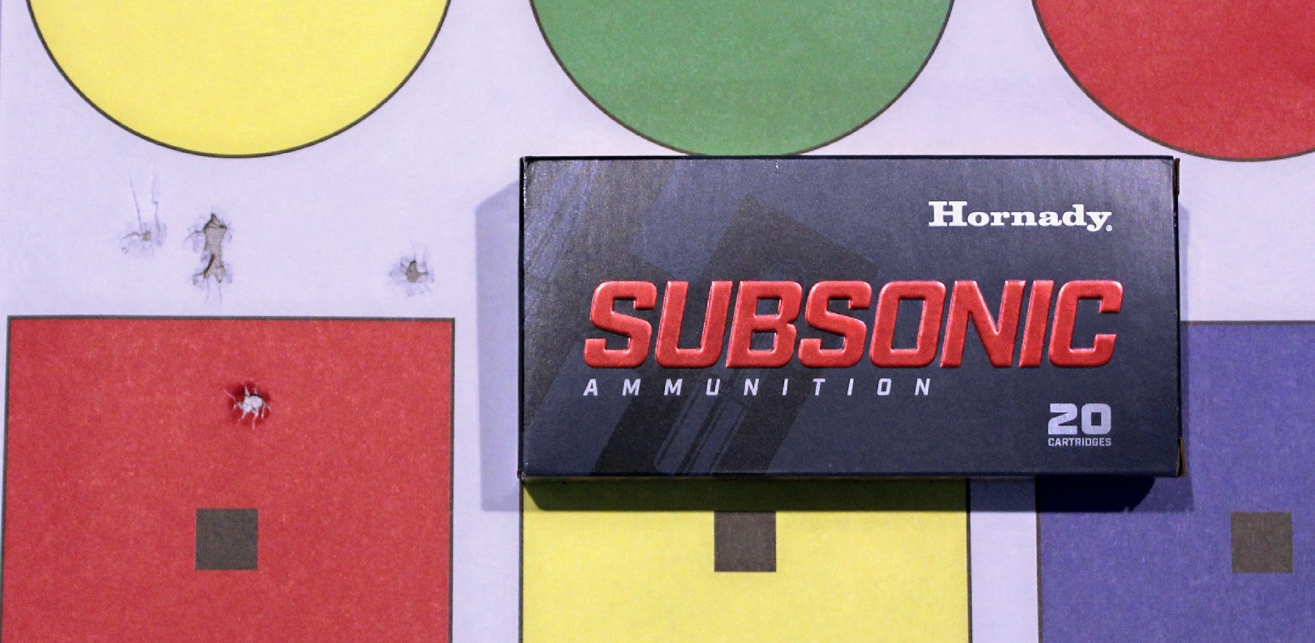 Hornady subsonic ammunition box with target colored shapes accuracy group